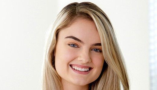 Woman in white top, indooLexie Fux: Biography, Age, Career & Net Worth 2025r setting.
